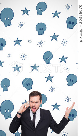Composite image of angry businessman gesturing on the phone 20356670