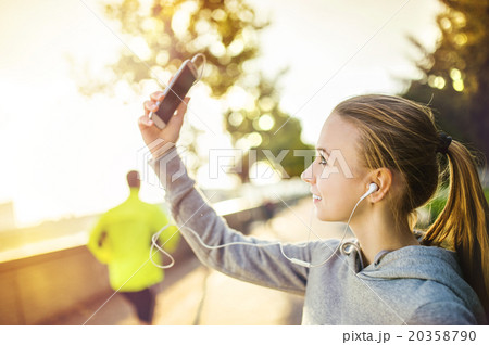 Female runner taking selfie 20358790