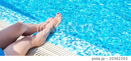 Female legs at blue water Female legs at blue water 20362203
