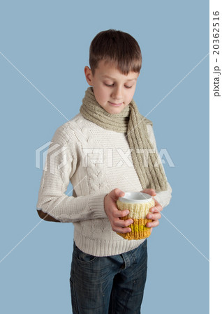 Cute boy with a white cup on blue background 20362516