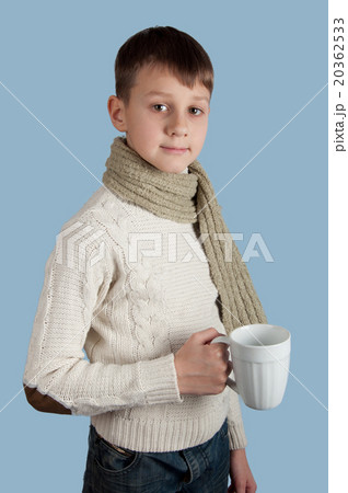 Cute boy with a cup on blue background 20362533