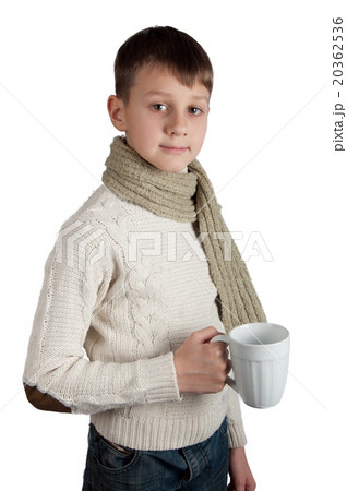 Cute boy with a cup isolated on white background Cute boy with a cup isolated on white background 20362536