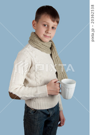 Cute boy with a white cup on blue background Cute boy with a white cup on blue background 20362538