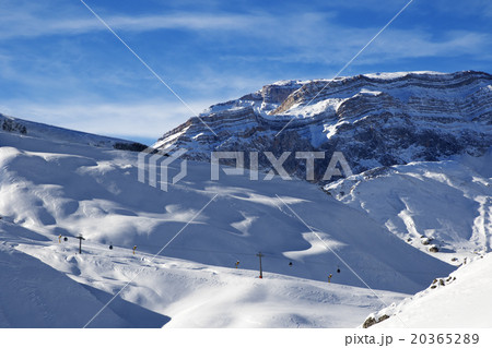 Ski resort and sunlight rocks at evening 20365289