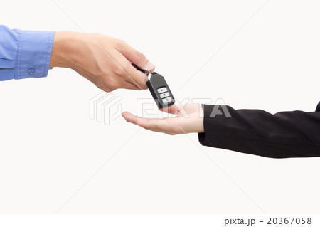 Businessman giving a new key car to businesswomen Businessman giving a new key car to businesswomen 20367058