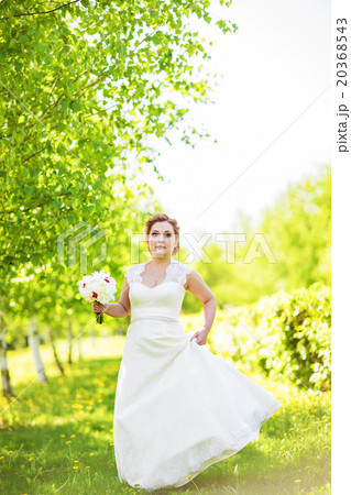 Beautiful bride outdoors  20368543