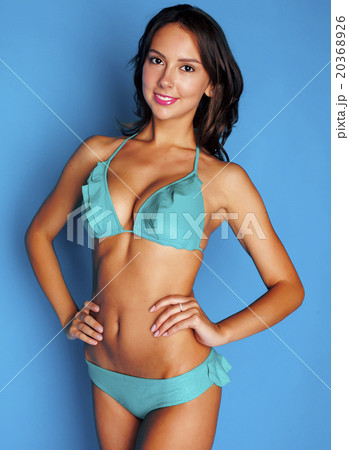 young pretty brunette girl in bikini smiling - Stock Photo [20368926] PIXTA