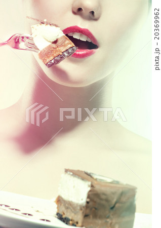 cream cake on white plate with pretty woman 20369962