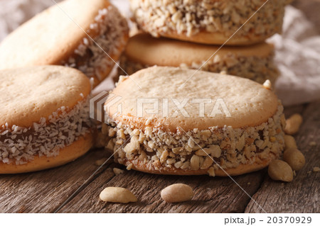 Alfajores cookies on paper on the table macro 20370929