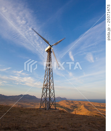 Wind turbine generating electricity in mountains Wind turbine generating electricity in mountains 20371478