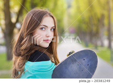 Teenage girl with skateboard Teenage girl with skateboard 20381249