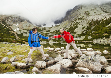 Senior couple hiking Senior couple hiking 20381252