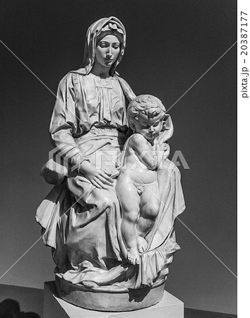 Old statue of a suffering woman with child Old statue of a suffering woman with child 20387177