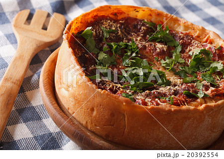 Spicy Chicago deep dish pizza closeup on a plate 20392554