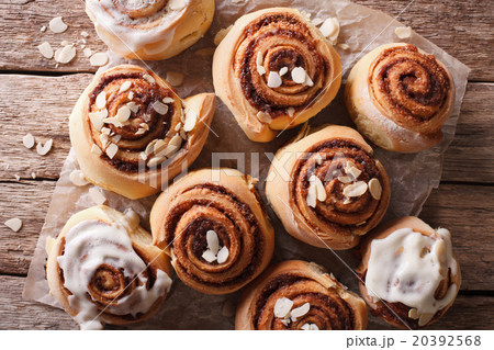 Glazed Cinnamon rolls with almond close up 20392568