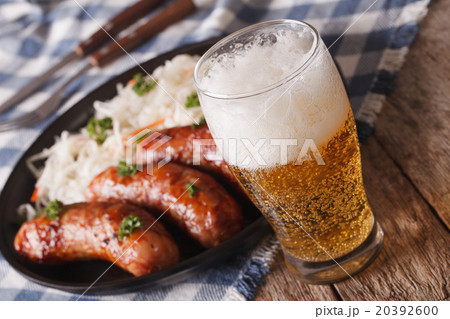 Lager beer and sauerkraut with sausage close-up 20392600