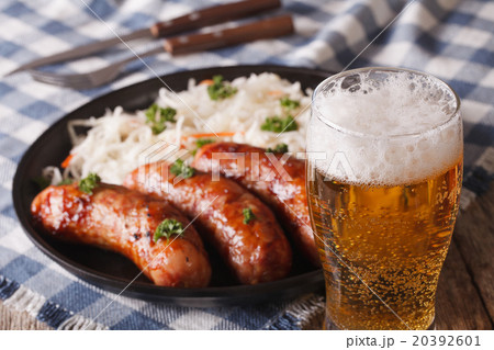 Lager beer and snacks of sausages and sauerkraut 20392601
