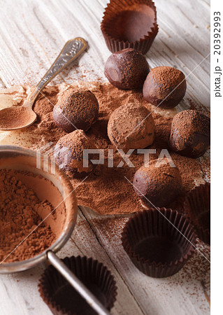 chocolate truffles sprinkled with cocoa powder 20392993