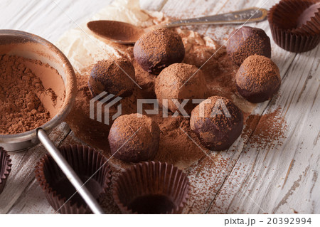 chocolate truffles sprinkled with cocoa powder 20392994