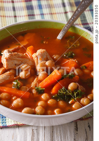 Delicious chickpea soup with chicken close-up Delicious chickpea soup with chicken close-up 20393050