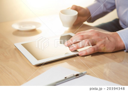 The male hands with a laptop and the cup 20394348