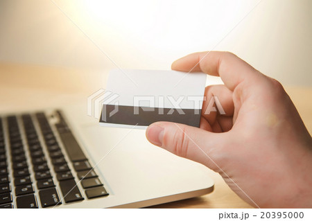 The man doing online shopping with credit card  20395000