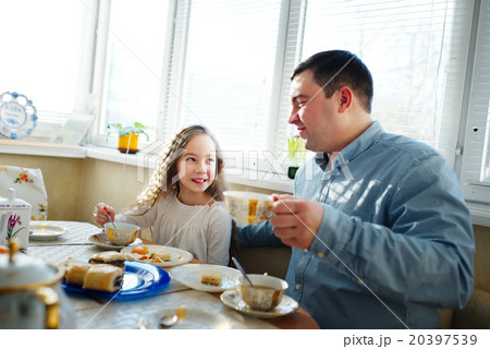 family has breakfast in the morning 20397539