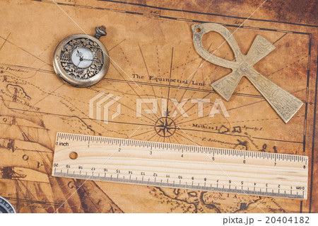 Old style brass pocket watch and cross on map Old style brass pocket watch and cross on map 20404182