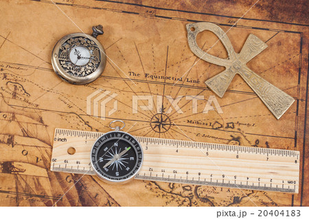 Old style brass pocket watch and cross on  map 20404183