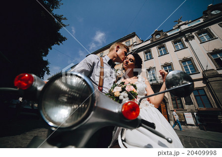 bride and groom on vintage motor scooter bride and groom on vintage motor scooter 20409998