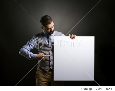 Hipster businessman with blank advertisement 20411024
