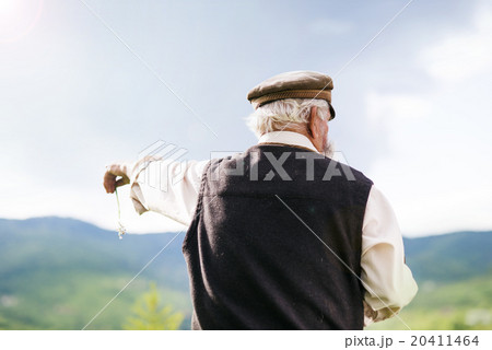 Old farmer on the meadow 20411464