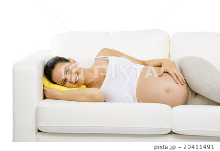 Pregnant woman lying on sofa Pregnant woman lying on sofa 20411491