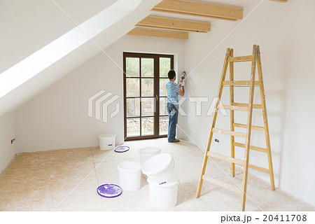 Man with caulking gun Man with caulking gun 20411708