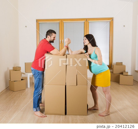 Pregnant mother and happy father in new house Pregnant mother and happy father in new house 20412126