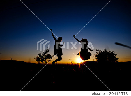 Silhouettes of happy girls Silhouettes of happy girls 20412558