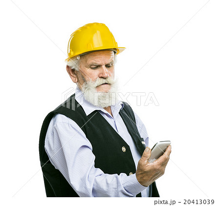 Senior manual worker with mobile phone isolated Senior manual worker with mobile phone isolated 20413039