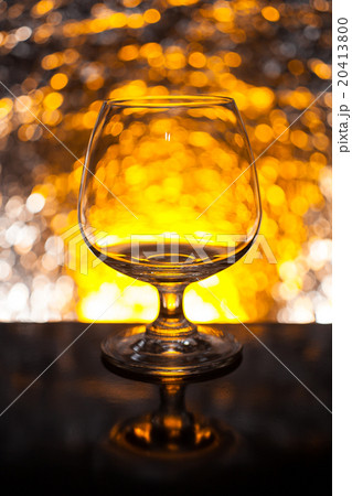 Whiskey glass empty on the background bokeh Whiskey glass empty on the background bokeh 20413800
