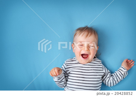 little boy on blue blanket background 20428852