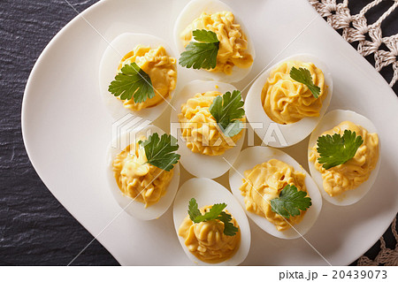 Stuffed eggs with mustard and parsley close-up 20439073