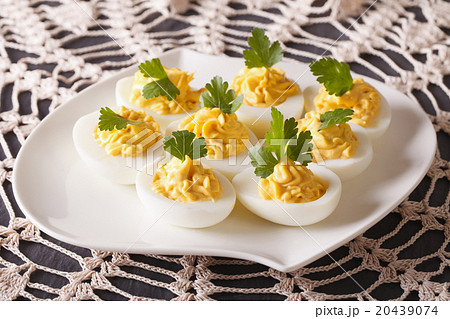 Stuffed eggs decorated with parsley close-up 20439074