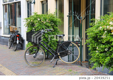 Parked bicycles near the old houses  20439251