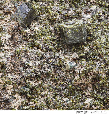 green epidote crystals on rock close up 20439402
