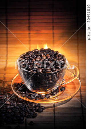 Steaming cup of coffee on fire 20441810