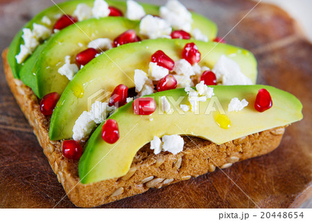 Avocado with Feta, pomegranate on sunflower seeds Avocado with Feta, pomegranate on sunflower seeds 20448654
