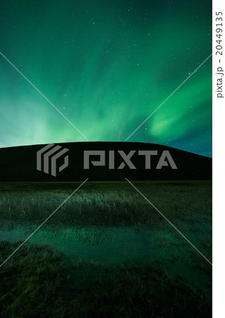 Aurora borealis above a mountain 20449135