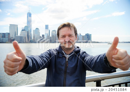 Happy man giving thumbs up sign 20451084