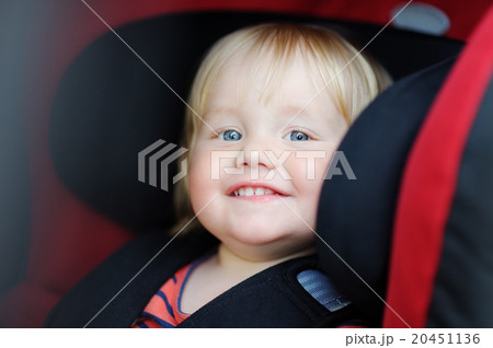 Toddler boy in car seat 20451136