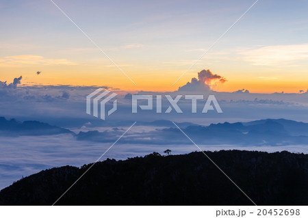 Layer of mountains and mist at sunset time Layer of mountains and mist at sunset time 20452698