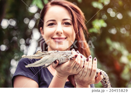 Young woman with crocodile 20455829